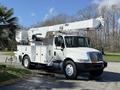 A white 2011 International 4300 bucket truck with an Altec aerial lift mounted on the truck bed