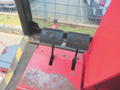Interior view of a 2013 Toro Grounds Master 5910 showing two large foot pedals on a platform