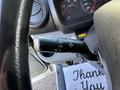 Close-up of the turn signal and headlight control stalk in a 2014 Hino 195 truck
