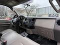 Interior of a 2008 Ford F-250 SD showing a light beige dashboard with controls and the word SUPER DUTY prominently displayed