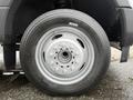 Close-up of the wheel of a 2018 Ford F-550 featuring a silver rim with multiple bolts and a black tire with a tread pattern