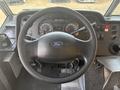 Steering wheel and dashboard of a 2018 Ford Econoline with gauges and controls visible