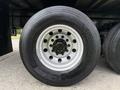 Close-up of a 2019 Ford F-750 wheel featuring a chrome rim with multiple lug nuts and a Continental tire displaying the model name and size