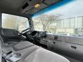 Interior of a 2008 International CityStar truck featuring a driver's seat dashboard and steering wheel with a touchscreen display