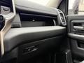 Interior view of a 2024 RAM 5500 dashboard featuring a sleek design with a focus on a modern glove compartment and control buttons