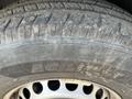 Close-up of a worn tire on a 2022 Mercedes-Benz Sprinter featuring the brand name Agilis on the sidewall and visible tread patterns