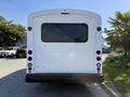 White 2017 Chevrolet Express van viewed from the rear with a large window and black bumper