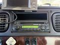 The image shows a dashboard with a radio display on a 2011 Freightliner M2 106 featuring buttons for power tuning and various functions