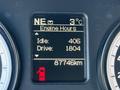The dashboard display of a 2015 RAM 4500 showing engine hours idle and drive time along with a fuel gauge indicating remaining fuel and total distance driven in kilometers