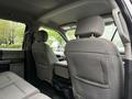 Interior view of a 2020 Ford F-550 featuring two front seats and a rear bench seat with a center console in between
