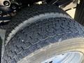 Close-up of a 2011 Ford F-550 tire showing detailed tread patterns and wear