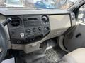 Interior dashboard of a 2008 Ford F-250 SD featuring climate controls audio system and gear shift