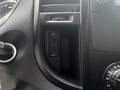 Interior view of a 2021 Mercedes-Benz Metris showcasing a console with USB ports and control knobs