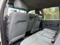 Interior view of a 2015 Ford F-350 SD showing leather seats in the back row with headrests and armrests