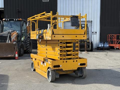 A yellow 2013 Haulotte Compact scissor lift with raised platform and guardrails featuring multiple sections for height adjustment