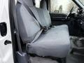 Interior view of a 2001 Ford F-350 showing two gray fabric front seats with seatbelts fastened