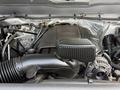 The engine of a 2016 Chevrolet Silverado 2500HD featuring an air intake system an alternator and various hoses and wiring connections
