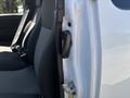 The image shows the interior of a 2011 Chevrolet Colorado with a focus on the door hinge and handle near the passenger seat