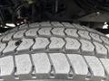 Close-up of a 2017 Autocar Xpert tire showing detailed tread pattern with grooves and sipes designed for traction and stability