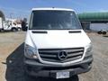 A white 2016 Mercedes-Benz Sprinter van with a grey front bumper and prominent Mercedes-Benz emblem on the grille