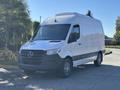 A 2021 Mercedes-Benz Sprinter 2500 van in white with a black front grille and black lower body standing on a paved area