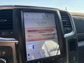 A 2018 RAM 3500 dashboard featuring a large touchscreen display showing navigation and other digital controls