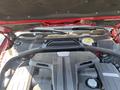 Engine of a 2015 Bentley Continental GT showing components like the intake manifold and cooling system parts