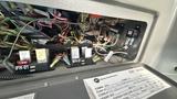 Interior view of a 2021 Ford Transit control panel showing various electrical connectors and wiring harnesses