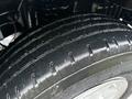 Close-up of a treaded tire from a 2013 Ford E-350 showcasing the rubber texture and patterns