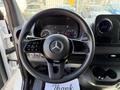 Interior view of a 2021 Mercedes-Benz Sprinter showing the steering wheel dashboard and control panel
