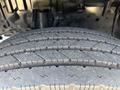 Close-up of a treaded tire from a 2018 Hino 195 showing detailed patterns and grooves designed for traction and performance