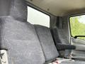 Interior view of a 2018 Hino 195 showing the front seats with a grey fabric pattern