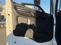 2018 Hino 268 truck door with black interior panel handle and armrest visible