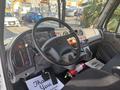 Interior view of a 2022 Freightliner M2 106 showcasing the steering wheel dashboard and control panel with various gauges and controls