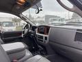 Interior view of a 2006 Dodge Ram 2500 showing the dashboard steering wheel and seats with a focus on the center console and controls