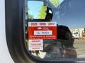 A 2020 Chevrolet Express with a certificate of approval sticker displayed on the window showing expiration dates and the months of January to March