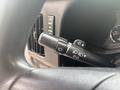 Close-up of the turn signal and wiper control lever from the steering wheel of a 2020 Chevrolet Express