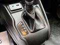 Gear shift lever of a 2017 RAM ProMaster City with a leather cover showing P R N D indicators