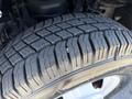 Close-up of a tire tread on a 2013 Chevrolet Express showing detailed patterns and wear on the rubber surface