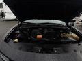 The image shows the engine bay of a 2017 Dodge Charger with visible components including the air intake system battery and coolant reservoir