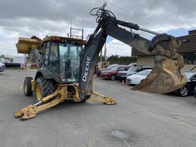 A 2012 John Deere 310SJ backhoe loader with a yellow and black color scheme featuring a front bucket and a rear digging arm