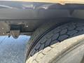 Close-up view of the rear dual tires of a 2020 Hino 338 showcasing the tread pattern and axle components