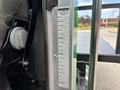 A 2013 Kenworth T370 with visible PACCAR information labels attached to the interior of the vehicle's door frame