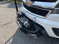 A 2017 Chevrolet Colorado with a winch mounted on the front bumper displaying a silver and black color scheme