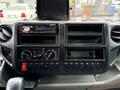 Dashboard of a 2015 Hino 195 featuring a car stereo multiple empty slots and various control knobs and buttons