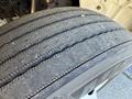 Close-up of a worn tire from a 2012 Freightliner M2 106 showing tread patterns and signs of usage