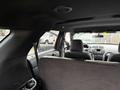 Interior view of a 2019 Ford Explorer showing the back seats and dashboard with controls and vents visible
