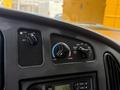 Dashboard controls of a 2008 Ford Econoline including fan speed and temperature settings