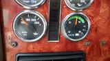 Dashboard of a 2003 International 5600i displaying gauges for oil temperature engine oil and voltmeter readings