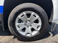 A close-up of the wheel of a 2017 Chevrolet Colorado featuring a silver alloy rim and a BFGoodrich All-Terrain tire